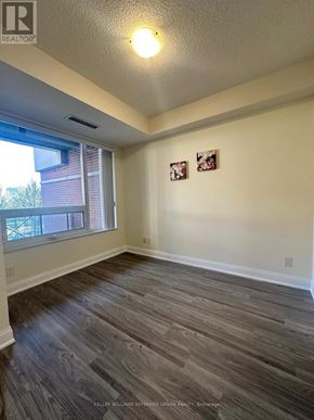 Markham (Unionville) condo for rent - A room with a window and two pictures on the wall.
