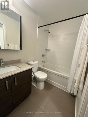 Markham (Unionville) condo for rent - A bathroom with a toilet, sink, and bathtub.