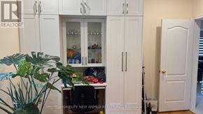 Markham (Milliken Mills East) apartment for rent - A white cabinet with glass doors is in the room.