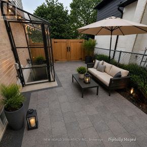 Newmarket (Central Newmarket) apartment for rent - A patio with a couch, table, and umbrella.