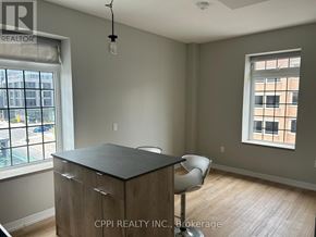 Oshawa (Central) condo for rent - A room with a desk and chair in it.