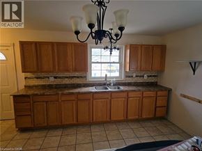 Cambridge apartment for rent - A kitchen with wooden cabinets and a chandelier.