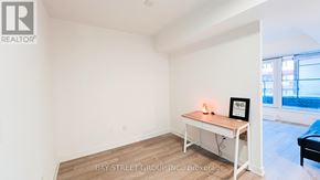Toronto (Clanton Park) condo for rent - A realtor photo of a small, empty room with a table and a picture frame.