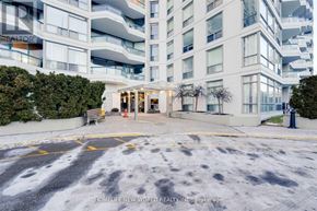 Toronto (Agincourt South-Malvern West) condo for rent - A large white building with a glass entrance and a sign that says "HOMELIFE NEW WORLD REALTY INC. Brokerage".