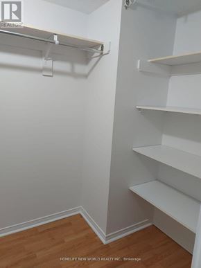Toronto (Agincourt South-Malvern West) condo for rent - A white closet with shelves and a brokerage logo.
