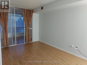 Toronto (Agincourt South-Malvern West) condo for rent - A room with wooden flooring and a window with brown curtains.