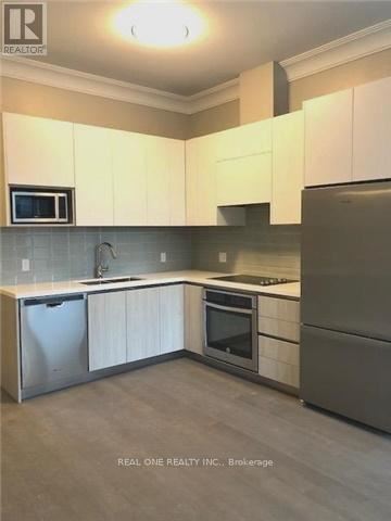 Markham (Unionville) condo for rent - A kitchen with white cabinets and stainless steel appliances.