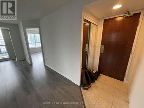 Toronto (Newtonbrook East) condo for rent - A room with a brown door and a tiled floor.