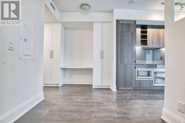 Toronto (Mount Pleasant West) condo for rent - A spacious kitchen with white cabinets and a modern design.