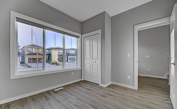Beaumont apartment for rent - A room with a large window overlooking a snowy landscape.