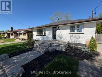 Oshawa (Eastdale) apartment for rent - A house with a stone walkway leading to the front door.