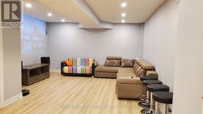 Markham (Cedar Grove) apartment for rent - A living room with a couch, a chair, and a television.