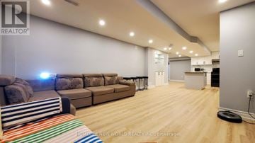 Markham (Cedar Grove) apartment for rent - A living room with a couch and a striped rug.