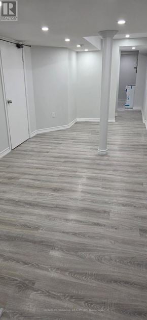Toronto (Rouge) townhouse for rent - A room with a grey carpet and white walls.