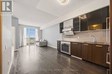 Toronto (Willowdale West) condo for rent - A kitchen with a wooden oven and cabinets.