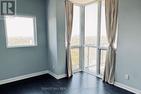 Toronto (Willowdale West) condo for rent - A room with a view of the city through large windows.