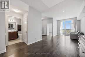 Toronto (Willowdale West) condo for rent - A room with a window and a view of trees outside.