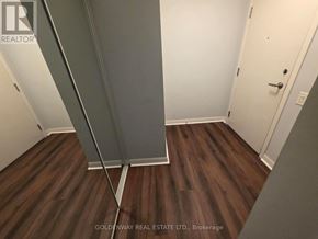 Toronto (Bendale) condo for rent - A room with a wooden floor and a white door.