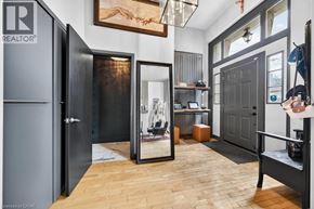 Hamilton apartment for rent - A room with a wooden floor and a large mirror on the wall.