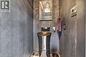 Hamilton apartment for rent - A bathroom with a large mirror and a pedestal sink.