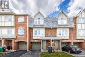 Mississauga (Cooksville) townhouse for rent - A building with the words "REAL BROKER ONTARIO LTD" on the top left corner.