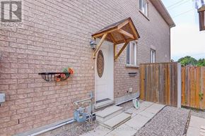 Whitby (Blue Grass Meadows) apartment for rent - A brick house with a white door and a small porch.