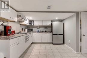 Whitby (Blue Grass Meadows) apartment for rent - A kitchen with white cabinets and a stainless steel refrigerator.