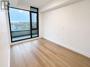 Hamilton (Beasley) condo for rent - A room with a sliding glass door leading to a balcony.