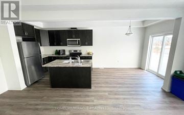 Thorold (Hurricane/Merrittville) townhouse for rent - A kitchen with black cabinets and a wooden island.