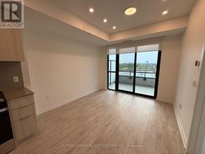 Milton (Cb Cobban) condo for rent - A room with a view of a body of water through a sliding glass door.