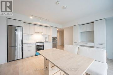 Toronto (Church-Yonge Corridor) condo for rent - A modern kitchen with a dining table and chairs.