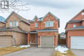 Vaughan (Maple) apartment for rent - A large brick house with a garage door in the center.