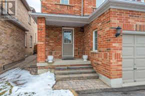 Vaughan (Maple) apartment for rent - A red brick house with a grey door and a white garage door.