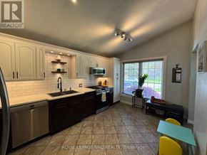 St. Catharines (Burleigh Hill) apartment for rent - A kitchen with a sink, stove, and refrigerator.