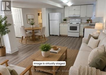 Oshawa (Central) apartment for rent - A virtual staged image of a modern kitchen and living room.