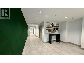 Burnaby apartment for rent - A hallway with a green wall on the left and a white wall on the right.