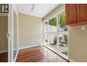 Vancouver apartment for rent - A room with a sliding glass door leading to a patio.