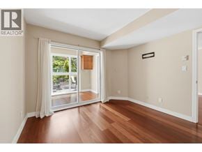 Vancouver apartment for rent - A room with a sliding glass door leading to a patio.