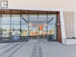 Toronto (Newtonbrook East) condo for rent - The entrance to a building with glass doors and a sign that reads "Golden Lion Residences.".