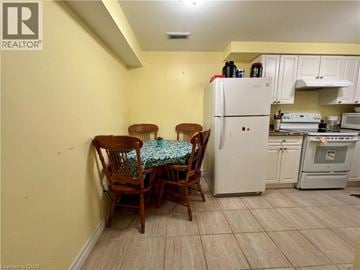 Cambridge apartment for rent - A kitchen with a table and chairs in the middle of it.