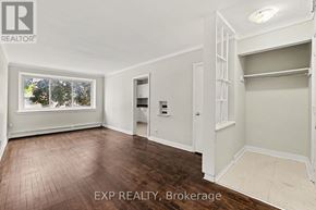 Ottawa multi-family for rent - A room with a window and a door is on the market.