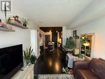 Toronto (Waterfront Communities) condo for rent - A living room with a brown leather couch and a flat screen TV.