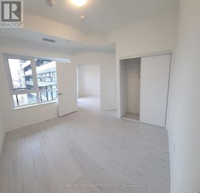 Oakville (Go Glenorchy) condo for rent - A white room with a window and a door is on the market with RE/MAX Escarpment Realty Inc.