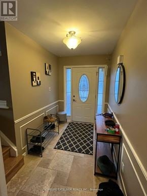 London North (North F) apartment for rent - A hallway with a white door and a black and white checkered rug.