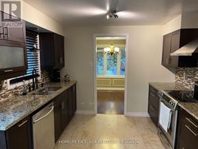 London North (North F) apartment for rent - A kitchen with granite countertops and stainless steel appliances.