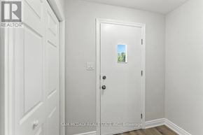 Oshawa (Lakeview) apartment for rent - A white door with a small picture of a tree on it.