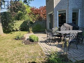 Markham (Thornlea) apartment for rent - A backyard with a table and chairs.