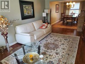 Markham (Thornlea) apartment for rent - A living room with a white couch and a glass coffee table.