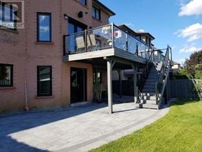 Richmond Hill (North Richvale) apartment for rent - A modern house with a balcony and stairs leading to the entrance.