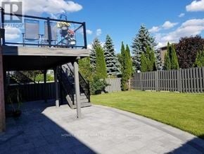 Richmond Hill (North Richvale) apartment for rent - A backyard with a deck and a fence.